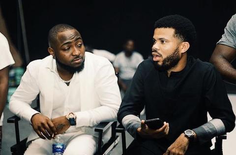 Davido and manager Asa Asika seated together