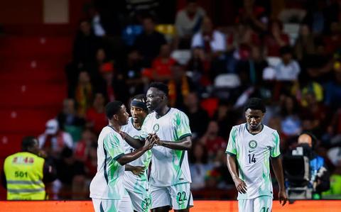 Super Eagles players on the pitch during a match