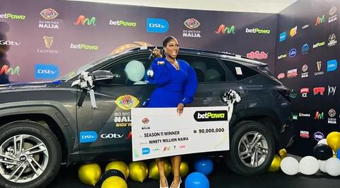 Temi Nkem with N90m cheque and new SUV