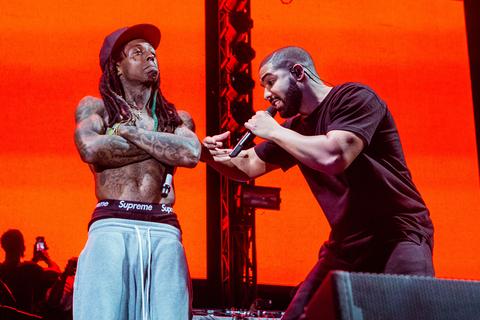 Lil Wayne and Drake performing on stage