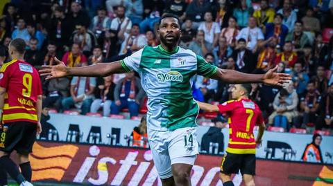 player in green and white jersey celebrating
