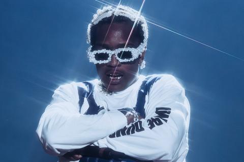 man in pearl glasses and white outfit