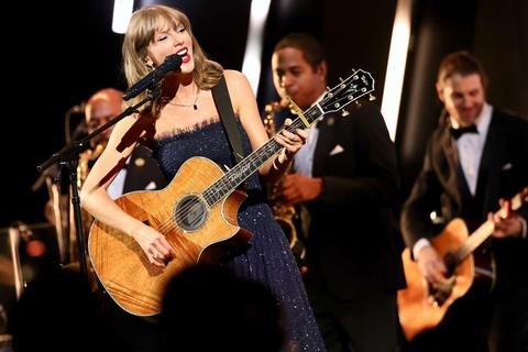 singer with guitar and band
