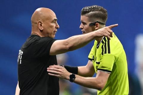 coach arguing with referee