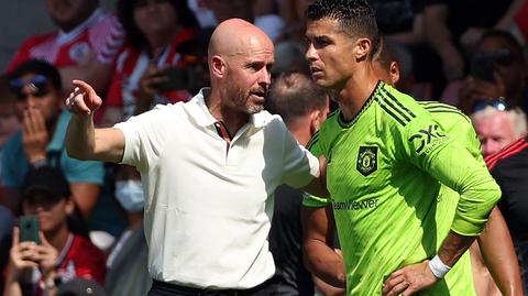manager gesturing while talking to player