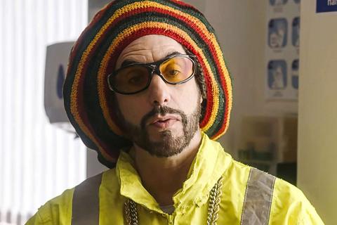 man in yellow jacket, yellow sunglasses and rasta hat