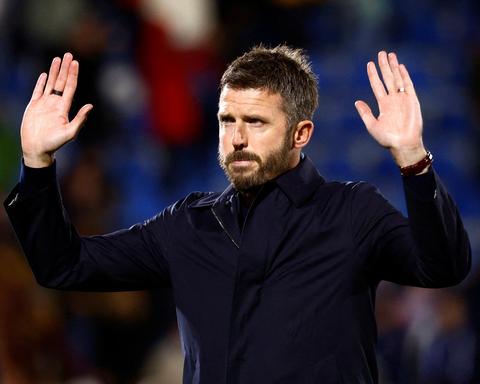 manager with hands raised