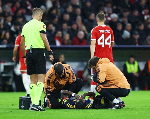 player on ground being treated by medical staff