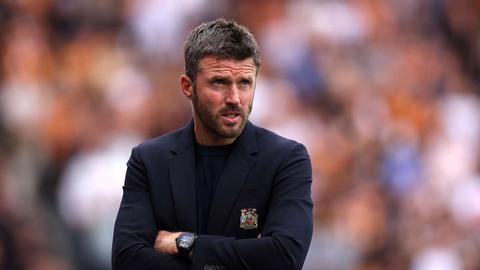 manager with arms crossed
