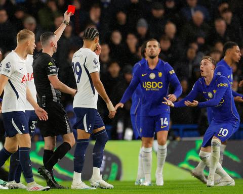Referee shows red card to Chelsea No 10 as players react