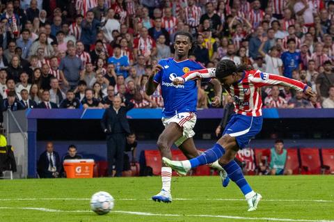 two football players competing for the ball