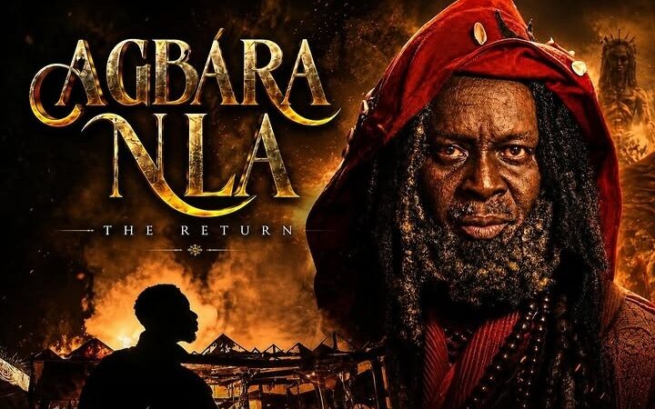Film poster art: title 'Agbara Nla: The Return' beside a close-up of the bearded man in a red hood, burning village belo