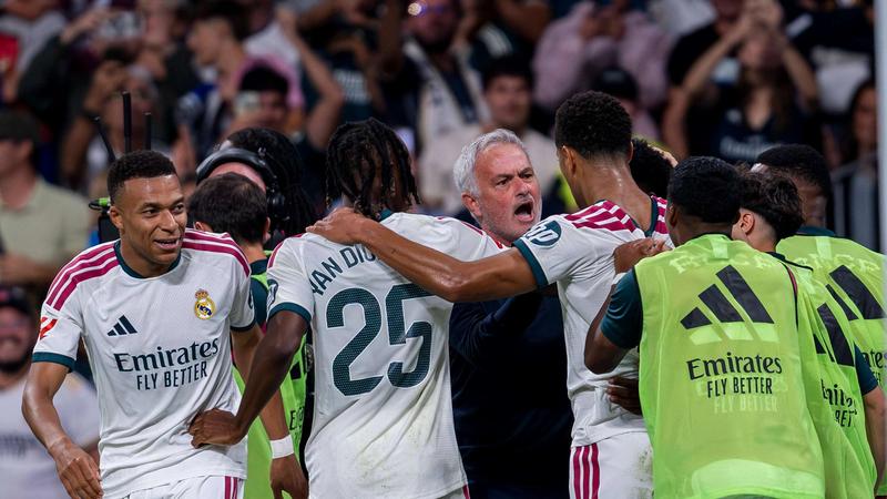 players in white kits and manager