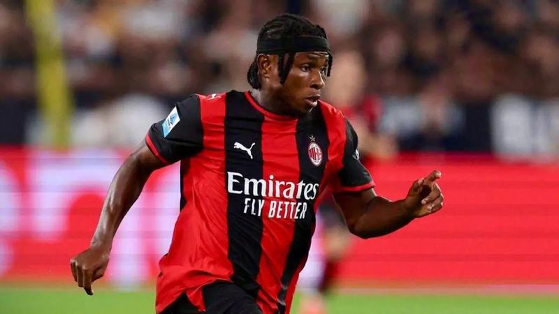 footballer in red and black kit