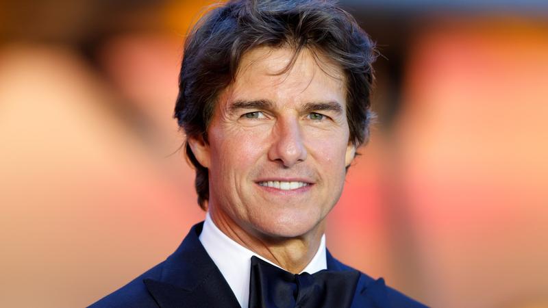 man in a tuxedo smiling