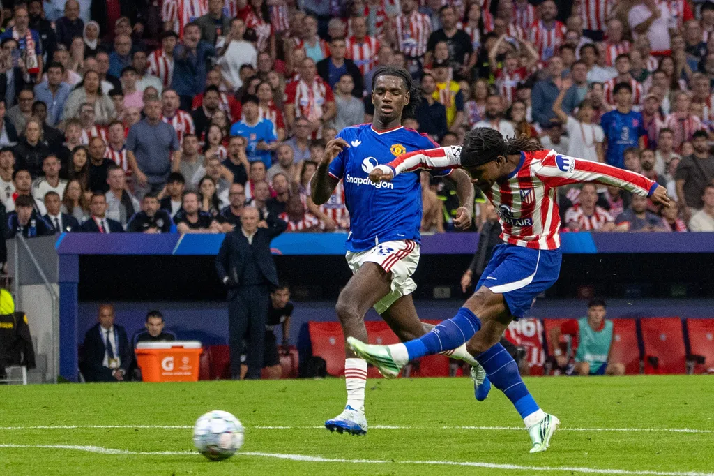 two football players competing for the ball