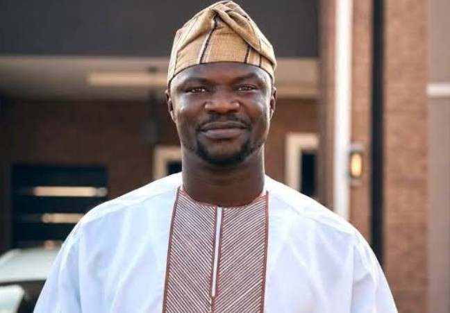 Toluwanisings, clean head-and-shoulders portrait in white outfit and cap; works well as the featured image