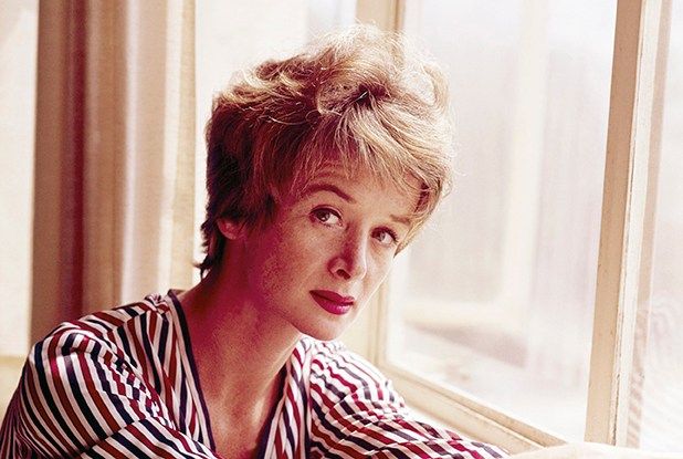 color portrait of Barbara Barrie in a striped top by a window