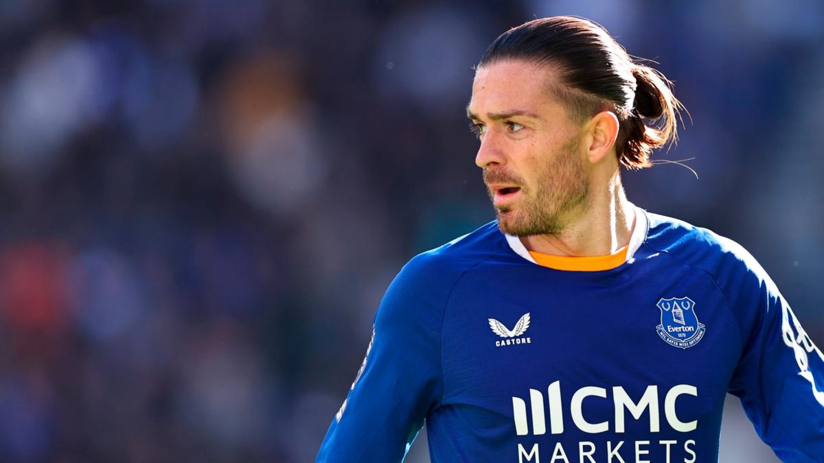 Jack Grealish in Everton's blue home kit, close-up during a match; only kit sponsor marks visible