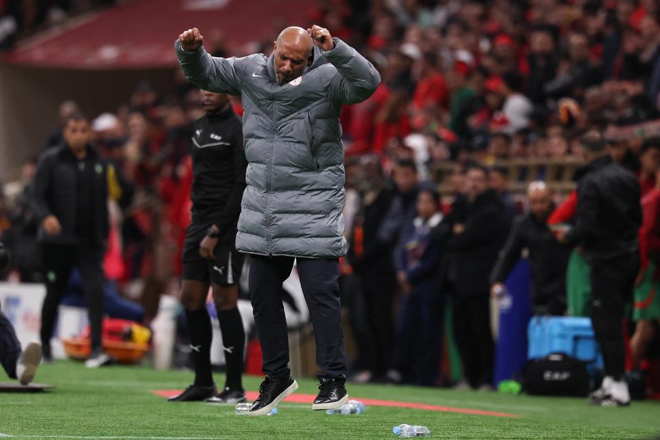 Eric Chelle reacting animatedly on the touchline