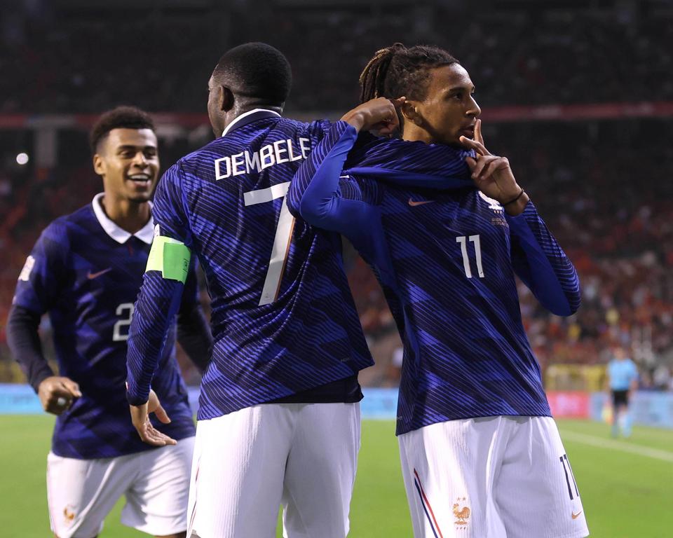 Michael Olise celebrating France's goal with teammates