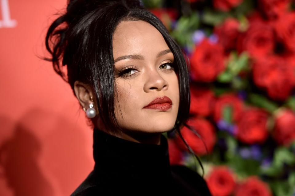 Rihanna portrait against rose backdrop