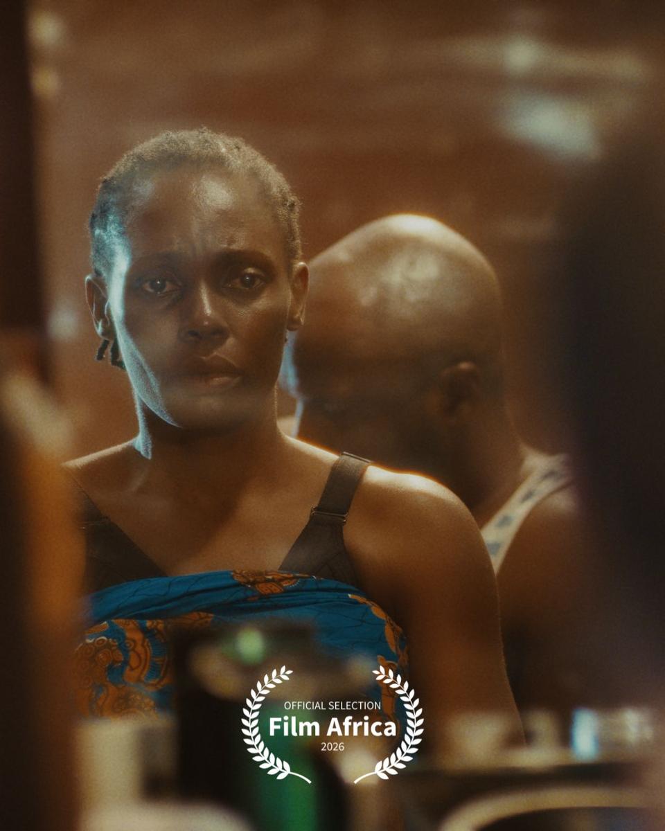 still from the film showing a woman, a child, and other people