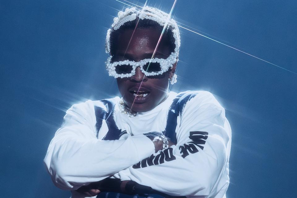 man in pearl glasses and white outfit
