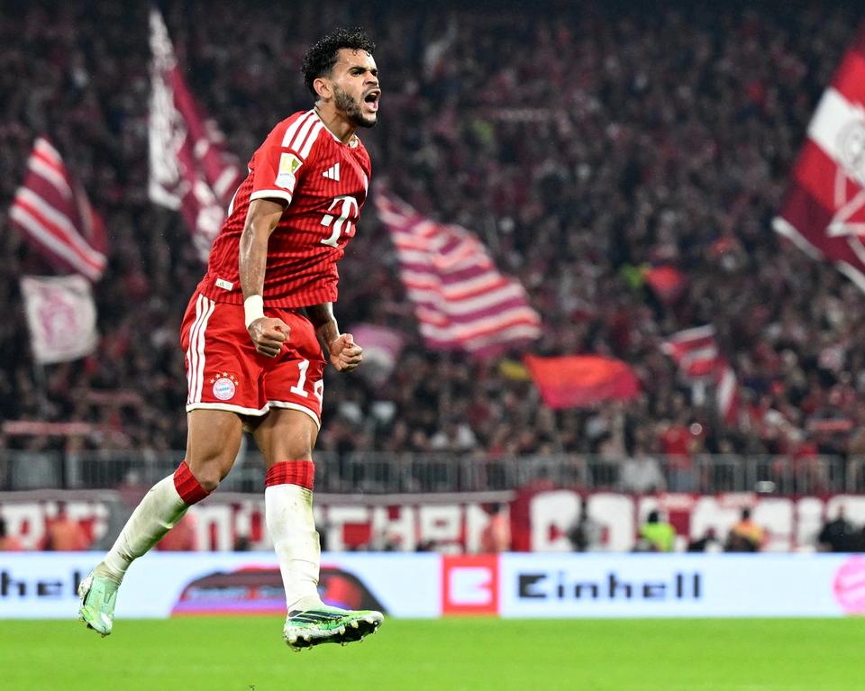 player in red kit celebrating
