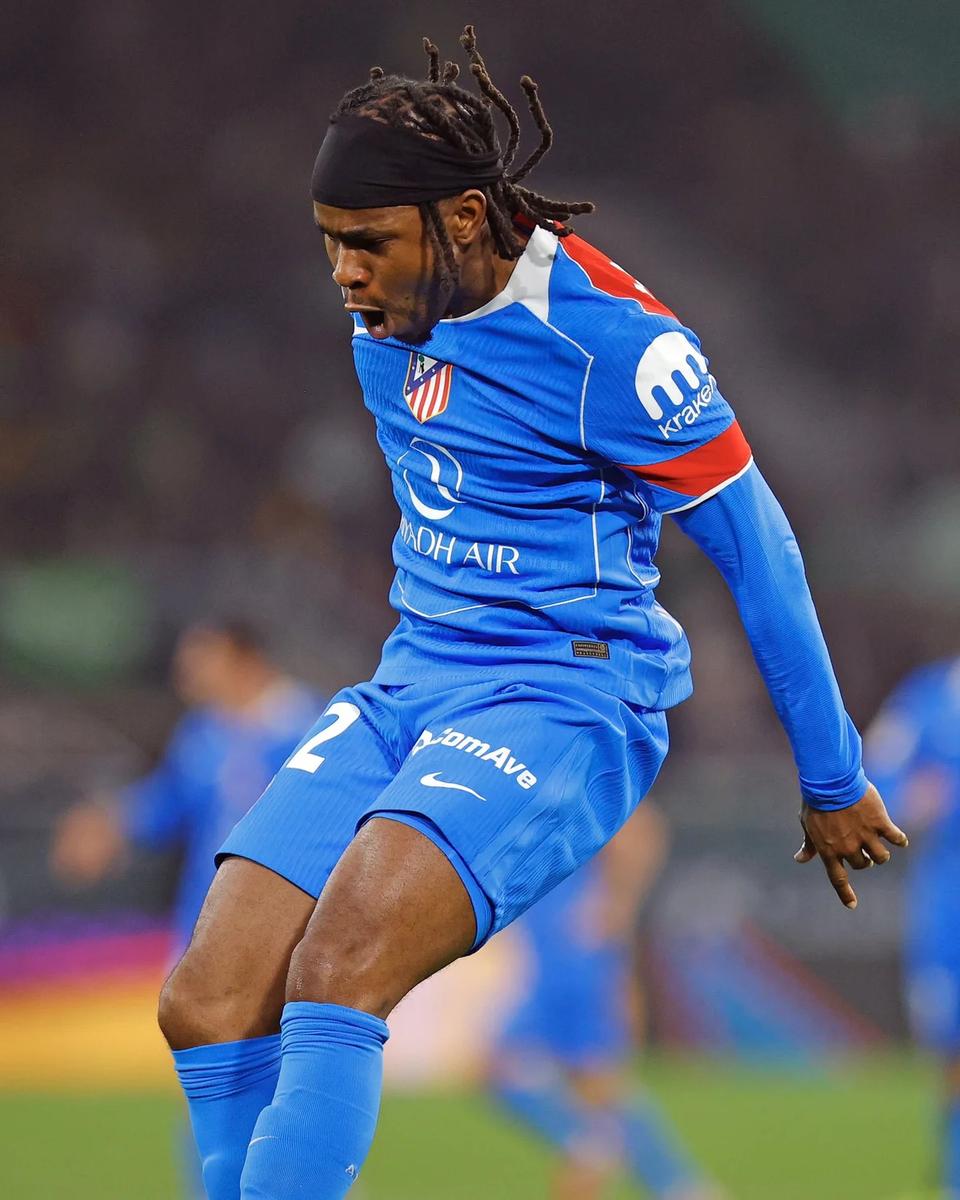 player in blue Atlético Madrid kit