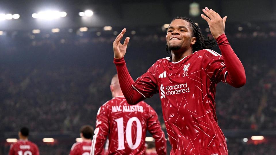 Liverpool player celebrating with arms raised