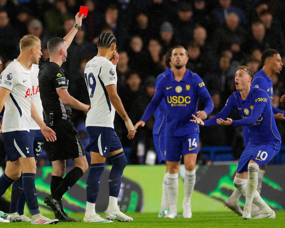 Referee shows red card to Chelsea No 10 as players react